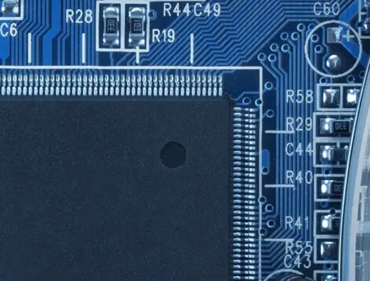 Clost up of blue circuit board and semiconductor wafer
